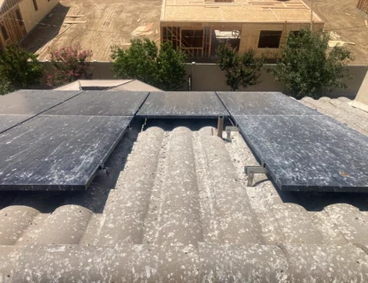 Dirty solar panels on a roof needing cleaning