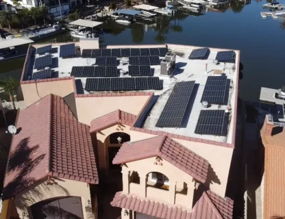 Aerial view of a house with solar panels on the rooftop, showcasing pristine clean solutions