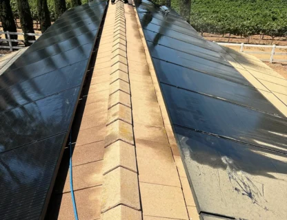Solar panels reflecting clouds on a rooftop, showcasing pristine clean solutions