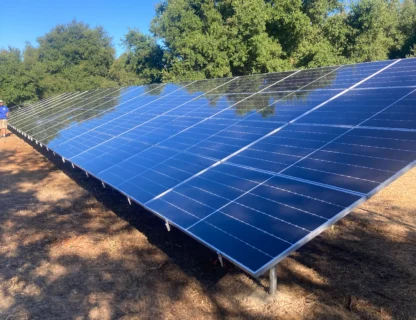 Solar panels reflecting sunlight, emphasizing sustainable energy practices.