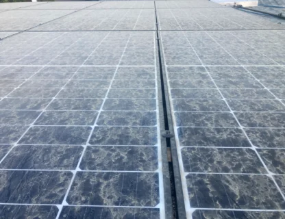 Close-up of dirty solar panels affecting energy efficiency